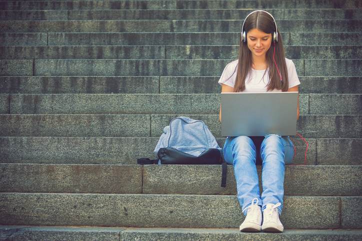 Beautiful Teenage Girl Learning Outdoors